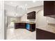 Kitchen area with granite countertops, tiled flooring, and stainless steel appliances at 10313 Sw 45Th Ave, Ocala, FL 34476
