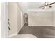 A spacious carpeted living room with archways leading to other areas of the home at 10313 Sw 45Th Ave, Ocala, FL 34476