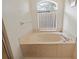 Close up of a luxurious bathtub with jets and neutral decor at 10716 Sw 53Rd Cir, Ocala, FL 34476