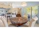 Cozy breakfast nook with sliding glass doors to the outside, neutral decor and view to the living room at 10716 Sw 53Rd Cir, Ocala, FL 34476