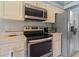 Kitchen with stainless steel appliances, including microwave, oven and refrigerator, with ample counter space at 10716 Sw 53Rd Cir, Ocala, FL 34476