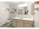 This bathroom has modern fixtures and a large vanity with storage, enhanced by natural light at 11237 Sw 78Th Ct, Ocala, FL 34476