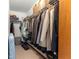 Walk-in closet offering wire shelves, hanging space for clothing, and carpeted floor at 11237 Sw 78Th Ct, Ocala, FL 34476