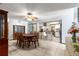 Spacious dining room and bar area with dining table, China cabinet, and view of kitchen at 11237 Sw 78Th Ct, Ocala, FL 34476