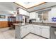 Bright kitchen featuring white cabinets, granite countertops, and stainless steel appliances at 11237 Sw 78Th Ct, Ocala, FL 34476