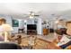 Comfortable living room with plush seating, a ceiling fan, and a large television at 11237 Sw 78Th Ct, Ocala, FL 34476