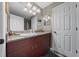 Bathroom featuring a vanity with a granite countertop, ample storage, and modern lighting fixture at 11521 Se 1St Street Rd, Silver Springs, FL 34488