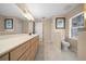 Bathroom featuring a long vanity with drawers and great lighting at 11521 Se 1St Street Rd, Silver Springs, FL 34488