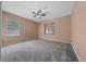 Spacious bedroom with neutral walls, carpeted floor, and two windows providing natural light at 11521 Se 1St Street Rd, Silver Springs, FL 34488