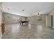 Large game room featuring a pool table, tile flooring, fan, neutral paint, and natural light at 11521 Se 1St Street Rd, Silver Springs, FL 34488