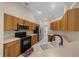 Well-equipped kitchen with stainless steel appliances, ample cabinetry, and a functional layout for cooking at 11521 Se 1St Street Rd, Silver Springs, FL 34488