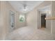 Bright living area with tile floors, a ceiling fan, and access to the lanai at 11521 Se 1St Street Rd, Silver Springs, FL 34488