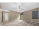 Comfortable main bedroom with carpet, natural light, and neutral paint colors at 11521 Se 1St Street Rd, Silver Springs, FL 34488