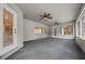 Spacious screened porch featuring ceiling fans and plenty of natural light at 11521 Se 1St Street Rd, Silver Springs, FL 34488
