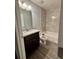 Compact bathroom features tiled walls, a vanity with a granite countertop, and a bathtub at 12472 Se 67Th Terrace Rd, Belleview, FL 34420