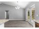 Bright dining area featuring modern flooring, neutral walls, stylish lighting, and glass doors to the backyard at 12472 Se 67Th Terrace Rd, Belleview, FL 34420