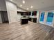 Spacious kitchen features dark wood cabinets, stainless steel appliances, and an island at 12472 Se 67Th Terrace Rd, Belleview, FL 34420