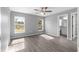 Bright main bedroom with a view of the backyard, complemented by an attached bathroom and a walk-in closet at 12472 Se 67Th Terrace Rd, Belleview, FL 34420