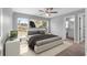 Cozy main bedroom with a view of the backyard, complemented by an attached bathroom for added privacy at 12472 Se 67Th Terrace Rd, Belleview, FL 34420