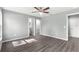 Serene main bedroom with neutral walls, modern floors, ceiling fan, and ensuite bathroom at 12472 Se 67Th Terrace Rd, Belleview, FL 34420