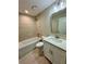 Bathroom featuring a bathtub-shower combination, and a modern vanity and mirror at 13303 Sw 106Th Pl, Dunnellon, FL 34432