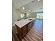 Open kitchen featuring a large island with stainless steel appliances and views of the living space at 13303 Sw 106Th Pl, Dunnellon, FL 34432