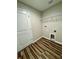 Laundry room featuring wood-look flooring, shelving, and hookups at 13303 Sw 106Th Pl, Dunnellon, FL 34432