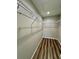 A well-organized walk-in closet features wire shelving and wood-look flooring at 13303 Sw 106Th Pl, Dunnellon, FL 34432