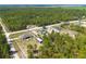 A scenic view of homes nestled among trees in a tranquil neighborhood with plenty of space at 13561 Sw 85Th Pl, Dunnellon, FL 34432