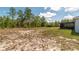 Wide view of the home and backyard, including the screened patio and plenty of space and trees at 13561 Sw 85Th Pl, Dunnellon, FL 34432