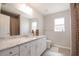 Bathroom featuring a granite countertop, and a shower with a decorative curtain at 13561 Sw 85Th Pl, Dunnellon, FL 34432