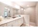 Bright bathroom featuring a double vanity with a granite countertop and a glass-enclosed shower at 13561 Sw 85Th Pl, Dunnellon, FL 34432