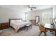 Serene bedroom with ample natural light, ceiling fan, and carpeted floors at 13561 Sw 85Th Pl, Dunnellon, FL 34432