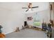 Spacious bedroom featuring a large window, wall decor, and ample space for activities at 13561 Sw 85Th Pl, Dunnellon, FL 34432