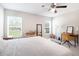Bright bedroom with large windows, a ceiling fan, and a cozy atmosphere at 13561 Sw 85Th Pl, Dunnellon, FL 34432