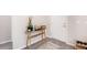 Clean entryway featuring a light wood console table, stylish decor, and a neutral rug at 13561 Sw 85Th Pl, Dunnellon, FL 34432