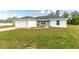 Home with a well-manicured lawn and fresh landscaping on a bright day at 13561 Sw 85Th Pl, Dunnellon, FL 34432
