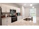 Kitchen features include stainless steel appliances, granite countertops and white cabinets at 13561 Sw 85Th Pl, Dunnellon, FL 34432