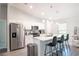 Modern kitchen with stainless steel appliances, granite countertops, and a breakfast bar at 13561 Sw 85Th Pl, Dunnellon, FL 34432