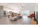 Spacious living room featuring an open floor plan and sliding glass doors to the outside at 13561 Sw 85Th Pl, Dunnellon, FL 34432