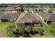 Aerial shot showcases the backyard, featuring a screened-in patio and well-maintained landscaping at 1377 Sw 161St Pl, Ocala, FL 34473