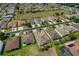 An aerial view of a residential street with well-manicured lawns and houses with brown roofs at 1377 Sw 161St Pl, Ocala, FL 34473