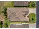 Overhead view of house featuring a screened-in patio and a well-manicured green lawn at 1377 Sw 161St Pl, Ocala, FL 34473