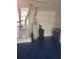 Basement area with a furnace, water heater, water softener, and blue flooring at 1377 Sw 161St Pl, Ocala, FL 34473