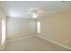 Neutral bedroom showcases carpet, ceiling fan, and bright window at 1377 Sw 161St Pl, Ocala, FL 34473