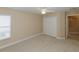 A simple bedroom with carpet, a ceiling fan, and a double door closet at 1377 Sw 161St Pl, Ocala, FL 34473