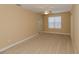Cozy bedroom with a ceiling fan, bright window, neutral carpeting and a warm ambiance at 1377 Sw 161St Pl, Ocala, FL 34473