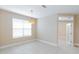 Bright dining area featuring tile floors, a modern light fixture, and large window at 1377 Sw 161St Pl, Ocala, FL 34473