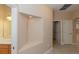 Hallway with recessed wall niche, open doorway, and bath vanity at 1377 Sw 161St Pl, Ocala, FL 34473