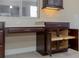 Close-up showcasing kitchen cabinetry with pull-out shelving and under-cabinet lighting at 1377 Sw 161St Pl, Ocala, FL 34473